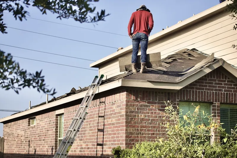 Professional roofer working on a residential roof in Long Valley
